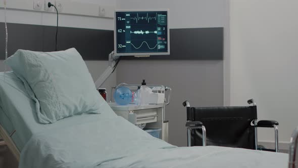 Empty Hospital Ward with Heart Rate Monitor and Bed