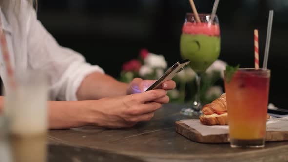 Women's Hands with a Phone