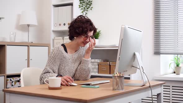 Young Blogger at Work Typing her New Post