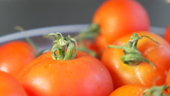 Tiny red cherry tomatoes in glass bowl slow panning 4K 3840X2160 UHD footage - Cherry red  tomatoes 