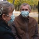 Senior Grandparents Couple in Medical Masks Sitting in Park - VideoHive Item for Sale