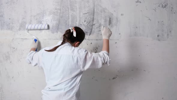 Inspired Designer Dances Painting Wall with Roller
