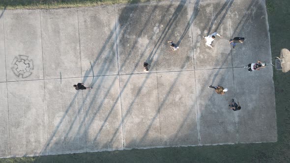 Drone Flying Over Young Men Playing Basketball