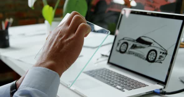 Car designer using glass digital tablet in office 4k