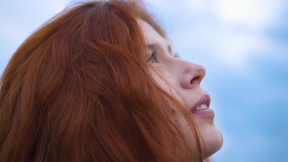 Portrait of Beautiful Young Redhead Woman Exploring Spirituality 