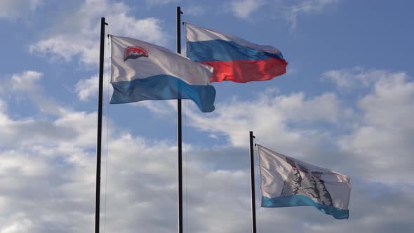 Waving Flags on Flagstaff: Flag of Russia, Flag of Kamchatka, Petropavlovsk City