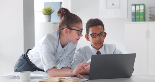 Kids As Office Managers Working on Laptop in Office