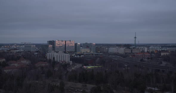 Pan of Helsinki cityscape at dusk. Finnish scenario at twilight. Aerial view