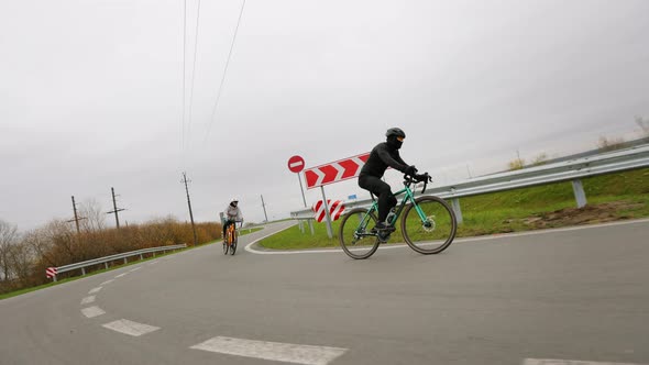 Two Cyclists are Training on the Track