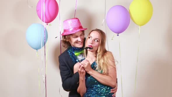 Cute couple dancing in photo booth