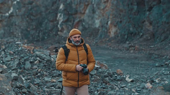 Photographer in the Mountains in  UHD