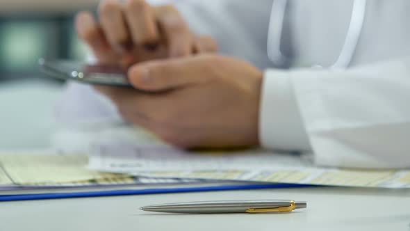 Physician Chatting With Patient on Smartphone, Pharmaceuticals and Healthcare