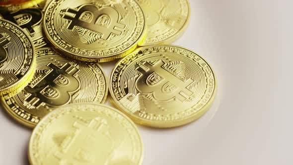 Rotating shot of Bitcoins (digital cryptocurrency) - BITCOIN 0169