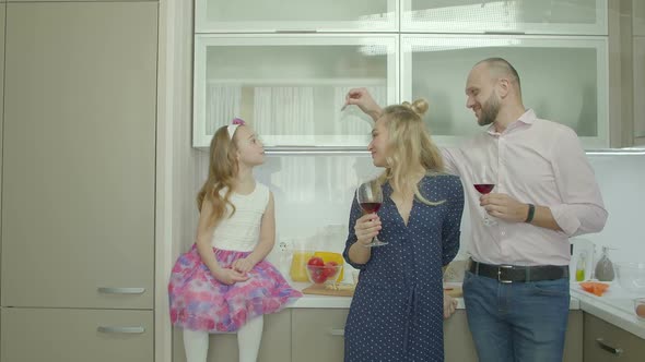 Playful Family Enjoying Leisure in Domestic Kitchen