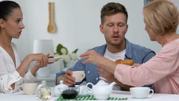 Mother and Daughter-In-Law Competing for Man Attention Treating Him With Dessert