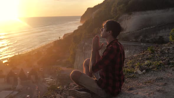 Silhouette of a Man Praying at Sunset Concept of Religion alt