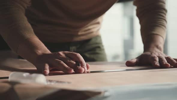 Insturments for Designer. Male Hands Draw with a Pencil and Ruler