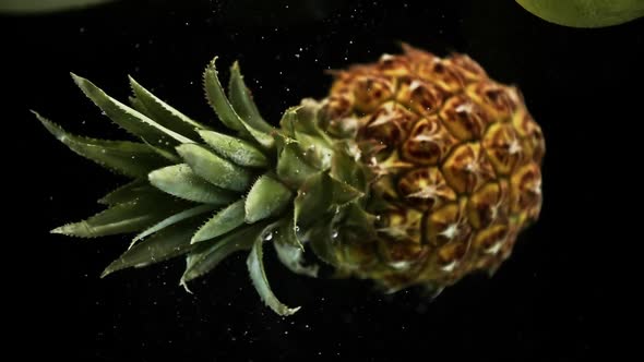 Pineapple Under Water Ratating on Black Background