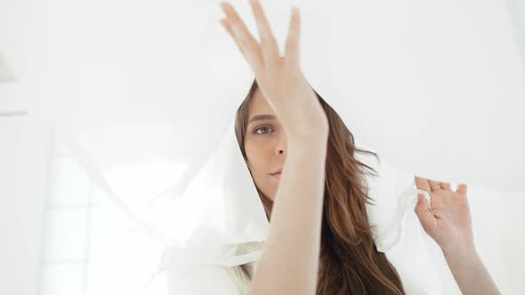 Young Beautiful Girl in White Decor