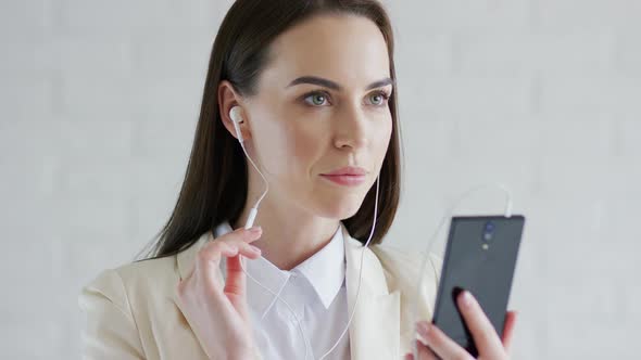 Businesswoman Listening To Music