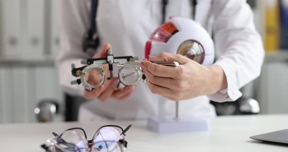 Ophthalmologist Shows Anatomy of Eye and Glasses for Selection of Optics