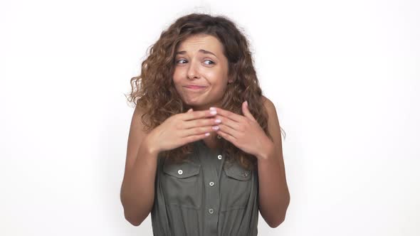 Caucasian Playful Girl Feeling Embarrassed Smiling Shrugging Throwing Up Hands to Sides Isolated on