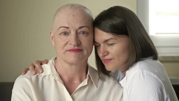 Young Woman Hugs Her Sick Mom After Chemotherapy