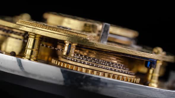 Working Mechanism of a Vintage Watch Close Up . Black Background. Time Lapse