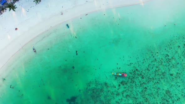 Aerial drone shot nature of relaxing shore beach lifestyle by blue sea with white sand background of