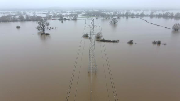 An Electricity Pylon in Deep Water in a Floodwaters Causing Power Outages 