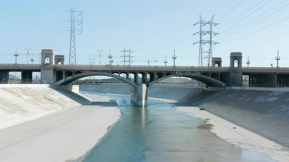 Scenic Blue Los Angeles River Under Concrete Bridge Captured in Hollywood Movies