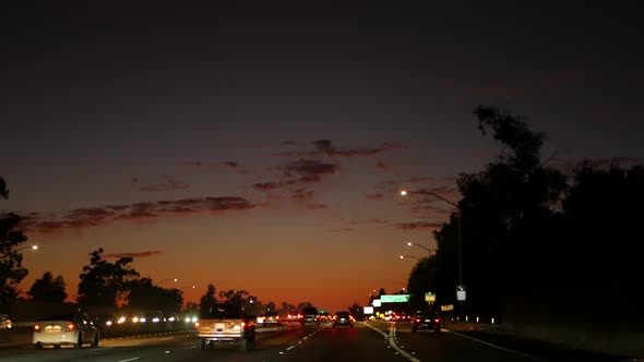 View From the Car. Los Angeles Busy Freeway at Night Time. Massive Interstate Highway Road