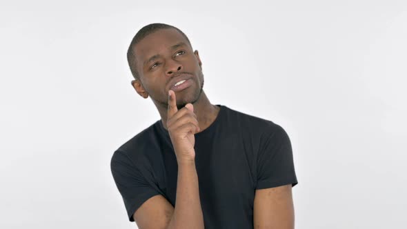 Pensive Young African Man Thinking an Idea on White Background
