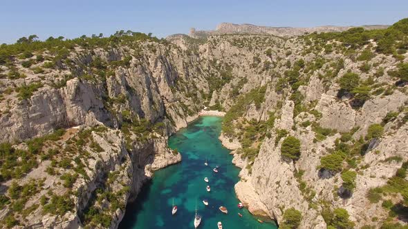 Aerial travel drone view of clear green water, cliffs of Cassis, Mediterranean Sea, Southern France.