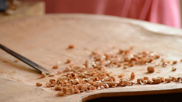 Luthier Working with a Gouge