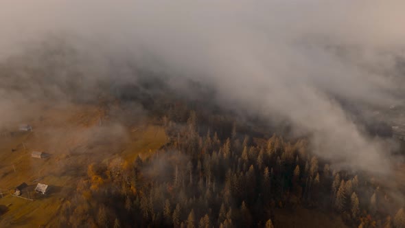 Aerial View of Time Lapse Sea of Fog Floating Rolling Over Mountain Valley Hills Islands at Sunrise