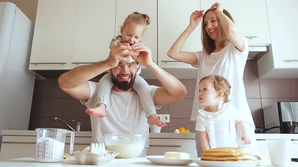 Bearded Pleasant Dad Teaching To Break Eggs