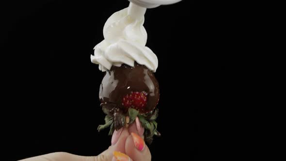 Strawberry with Melted Chocolate. Squeeze Out Whipped Cream on Top of the Berry