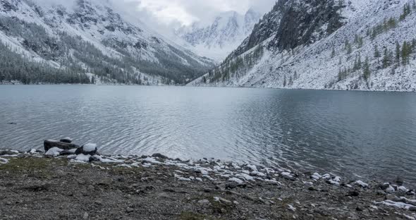 Snow Mountain Lake Timelapse at the Autumn Time. Wild Nature and Rural Mount Valley. Green Forest of