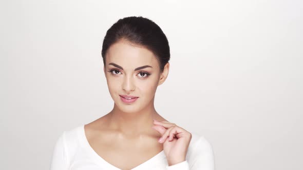 Studio portrait of young and beautiful brunette woman over