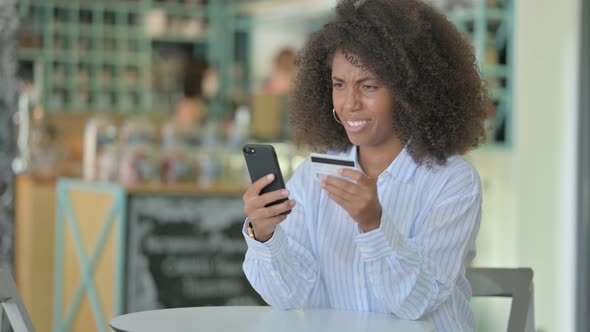 Unsuccessful Online Payment on Smartphone By African Woman 