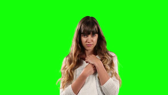 Front view of Caucasian woman with green screen