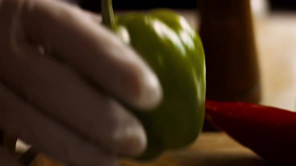 Hands Chopping Green Fresh Pepper on a Cutting Board Then Throws Peppers with a Knife