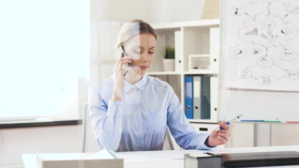 Businesswoman Calling on Smartphone at Office