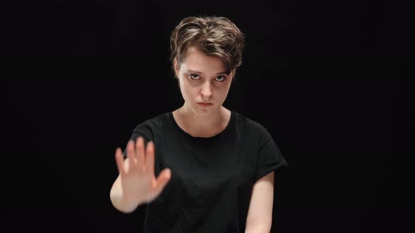 Sad Serious Brunette Woman Looking at Camera and Stretching Hand