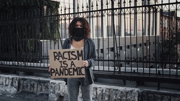 Afroamerican Female in Black Bandana on Face