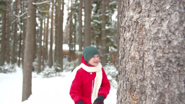 Dad and Boy Play Catch-up in Winter. Slowmotion