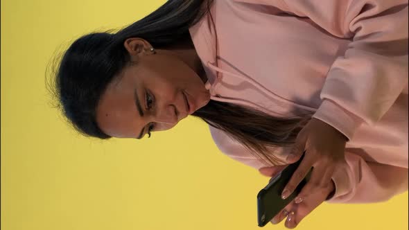 Pretty Black Woman Finding Something Incredible Surfing the Internet on Smartphone