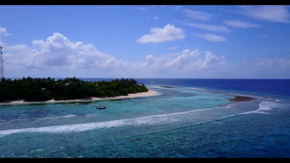 Aerial above seascape of idyllic lagoon beach trip by aqua blue lagoon and clean sandy background of