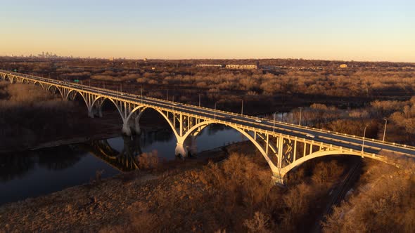 Dramatic aerial view of Mendota Bridge and surrounding area, during golden hour